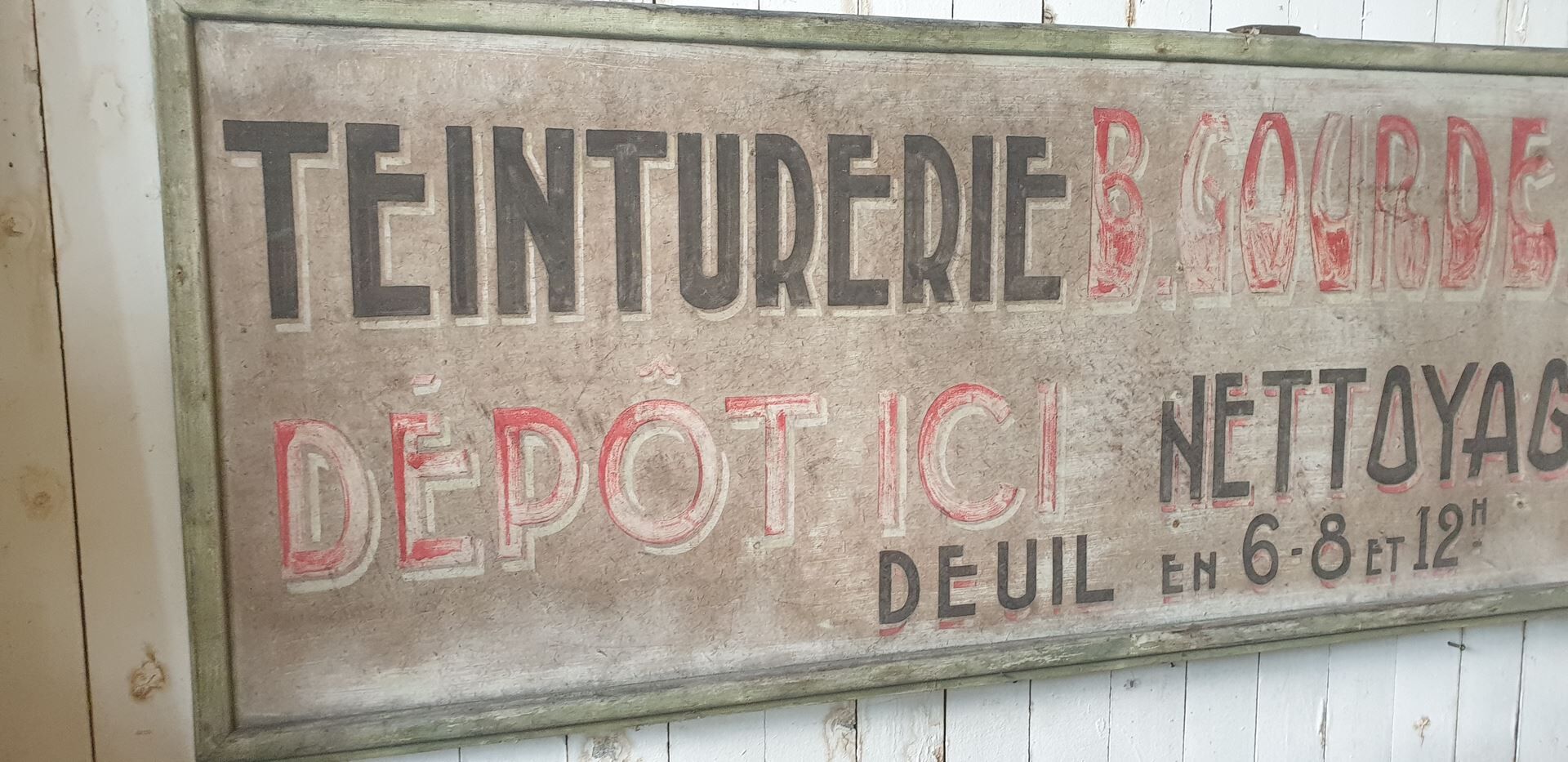former big wooden advertising sign