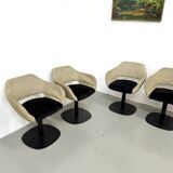 Series of six swivel chairs with an organic shell, patterned fabric and base.