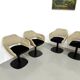 Series of six swivel chairs with an organic shell, patterned fabric and base.