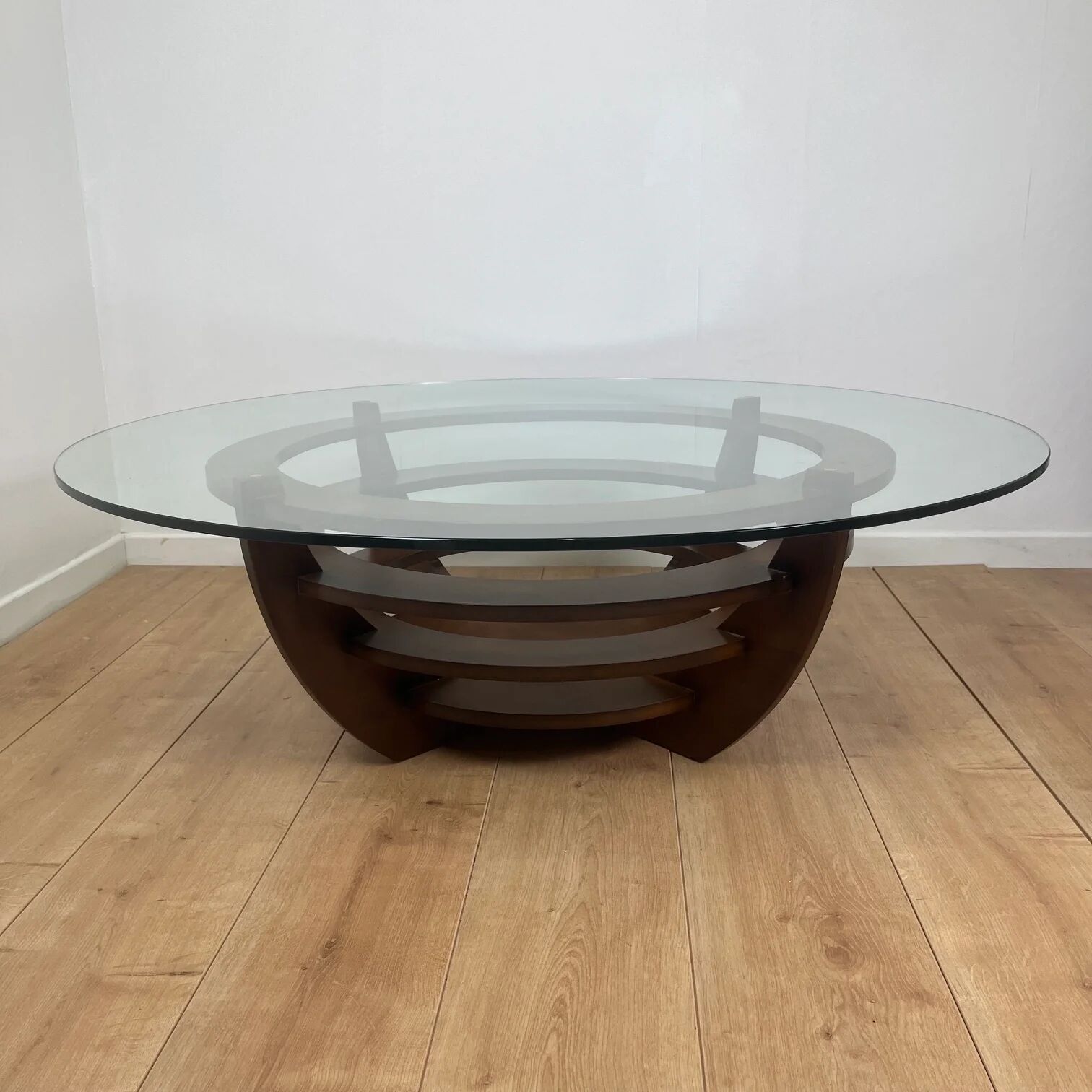 Sculptural coffee table with concentric rings, glass and wood, circa 1985.