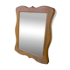 Wooden mirror with a shaped frame