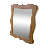 Wooden mirror with a shaped frame
