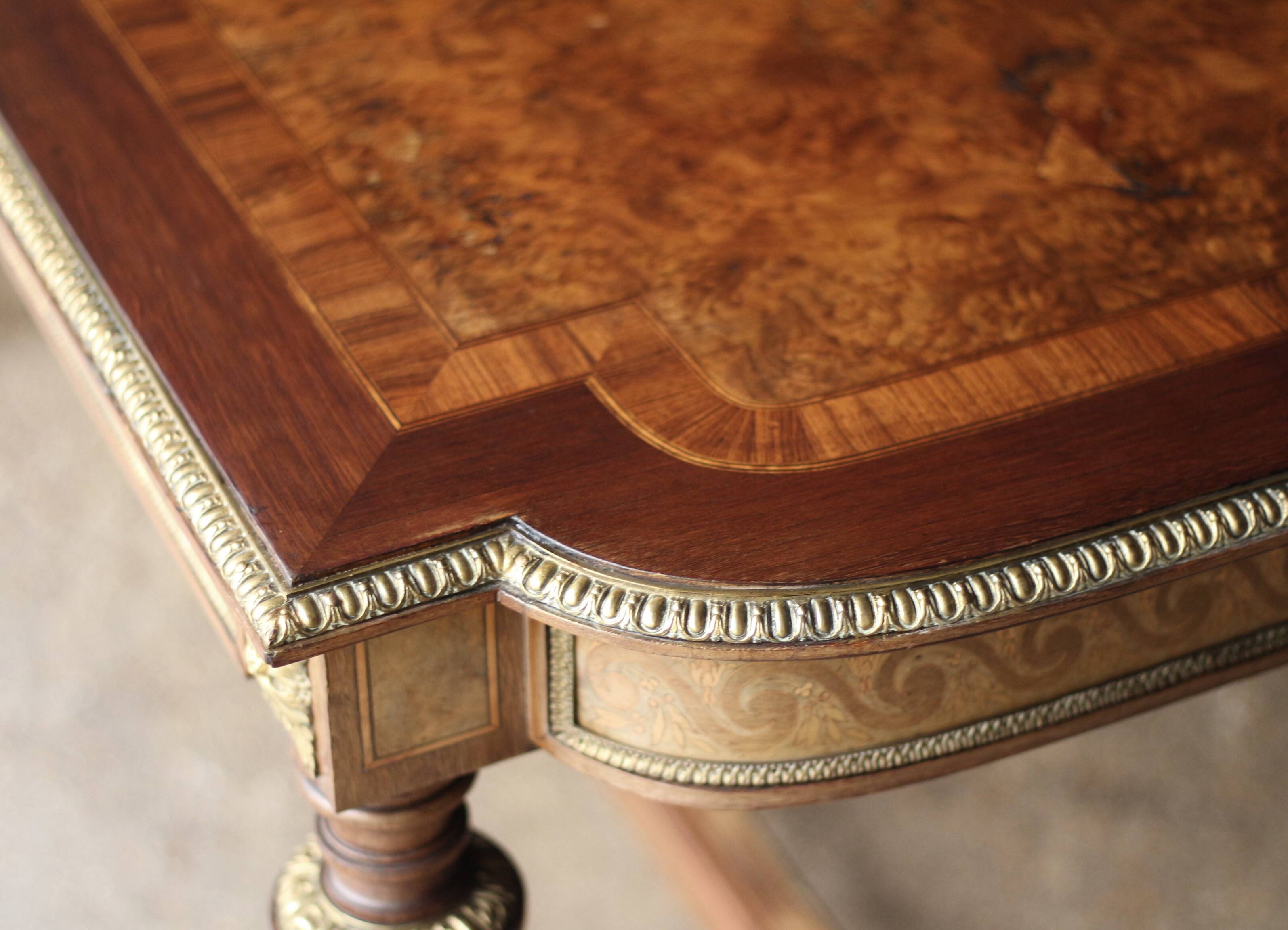 Superb Napoleon III table. Marquetry top and gilded bronzes.