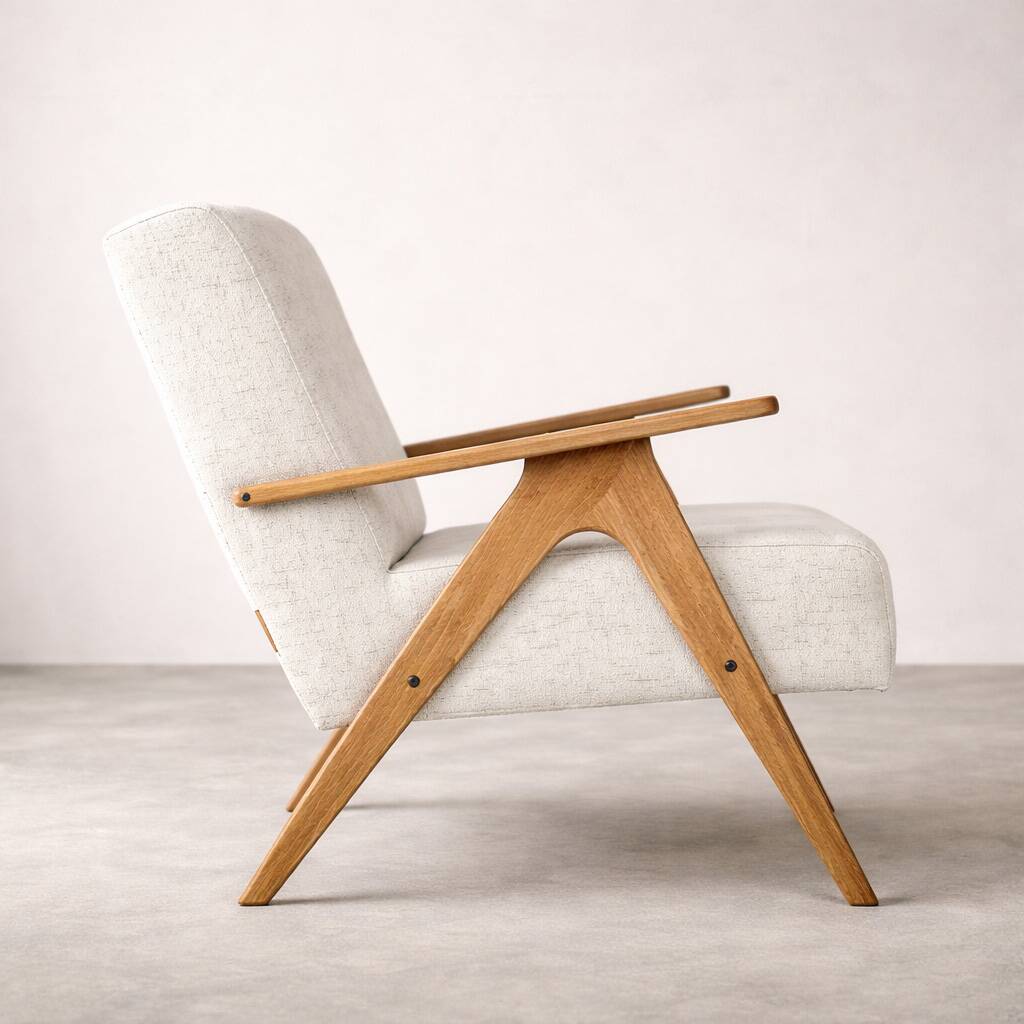 Mid-century modern armchair in solid wood and light beige fabric.