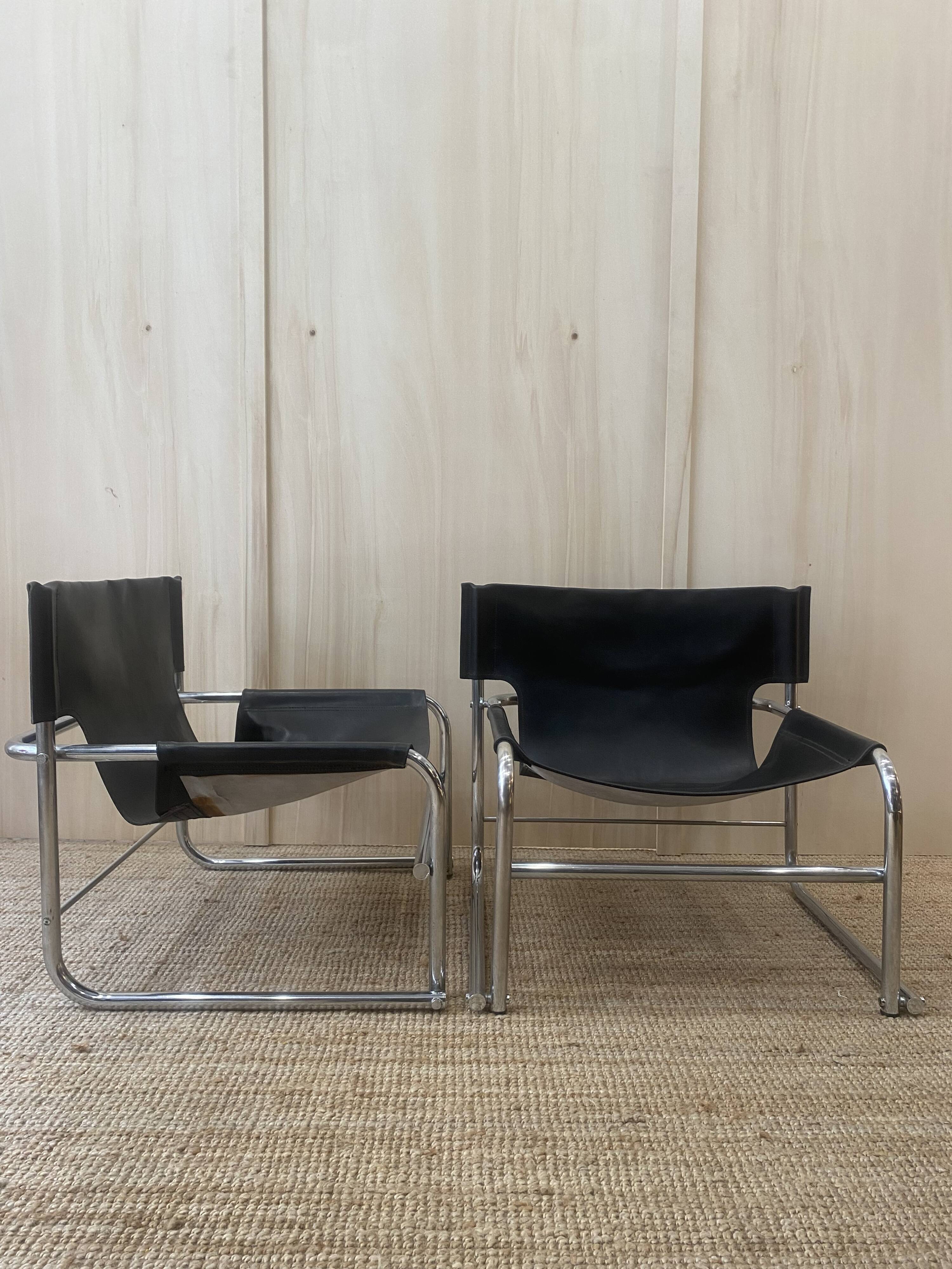 Black leather armchairs with a metal frame by Rodney Kinsman.