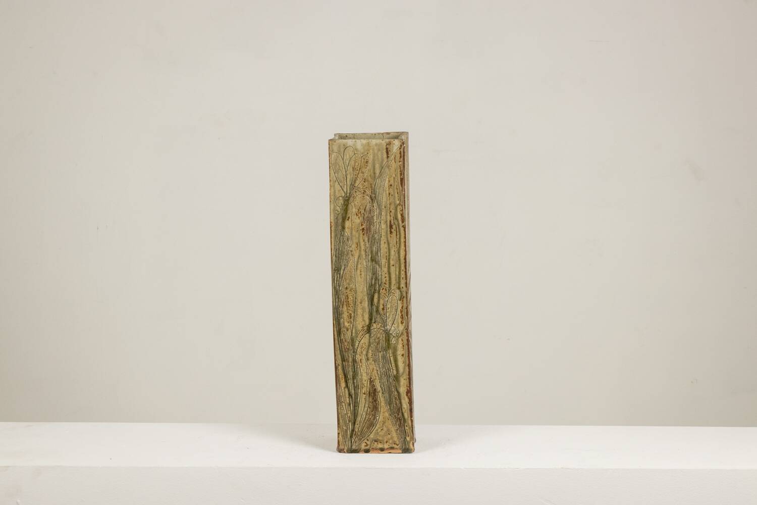 Brutalist stoneware vase with a floral design. 1970s.