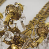 Two bronze and cut glass wall-mounted chandeliers