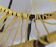 Pair of 60s tripod armchairs in metal and yellow scoubidou