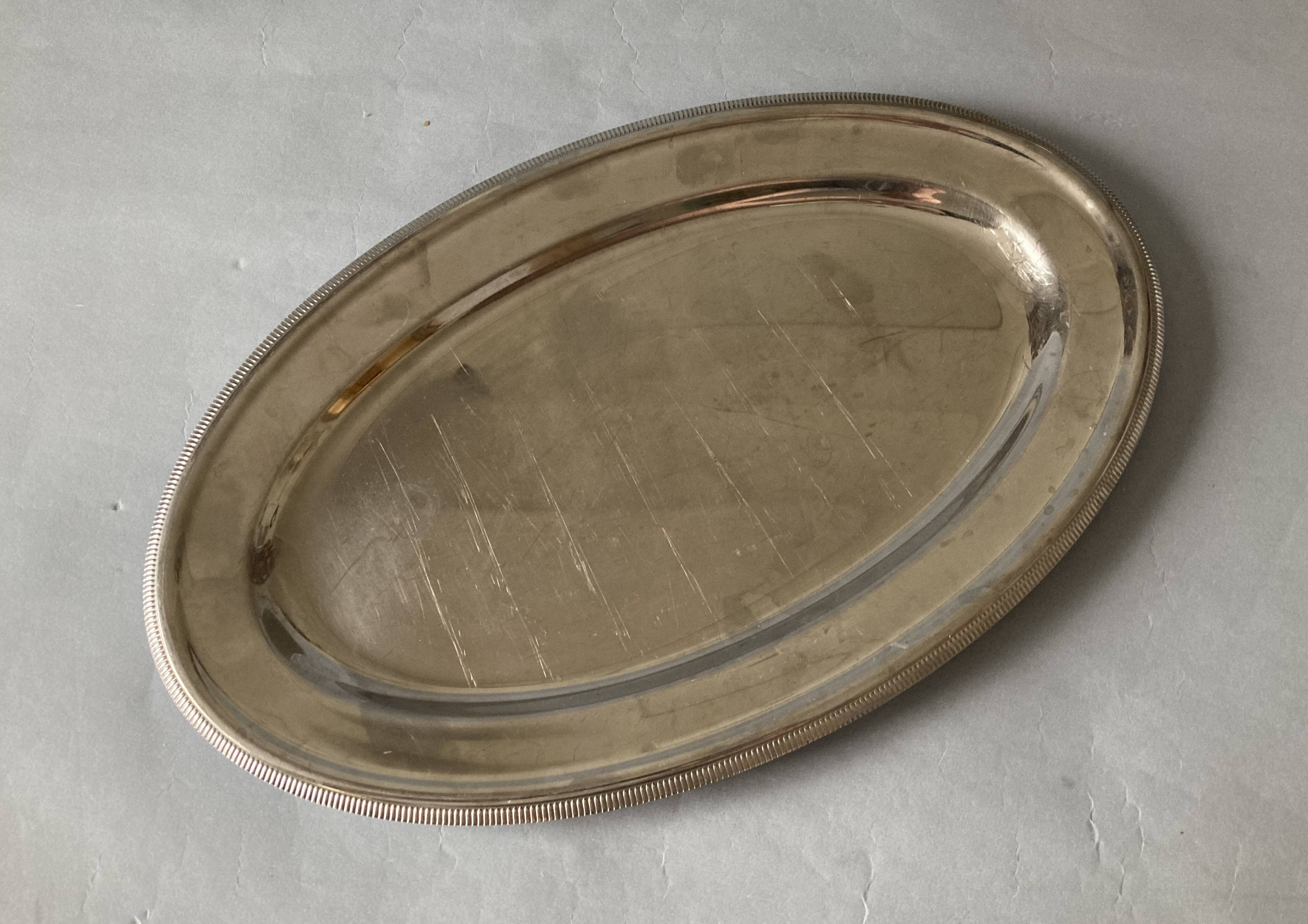 Set of three Letang & Remy stainless steel dishes.