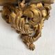 Antique wall console in wood and gilded stucco.