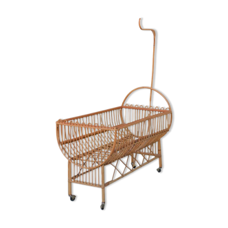 Vintage rattan crib, casters and matte for bed sky