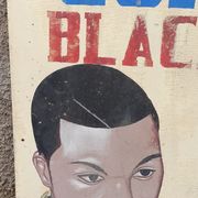 Ancienne enseigne de coiffeur africain