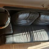 Black leather three-seater sofa