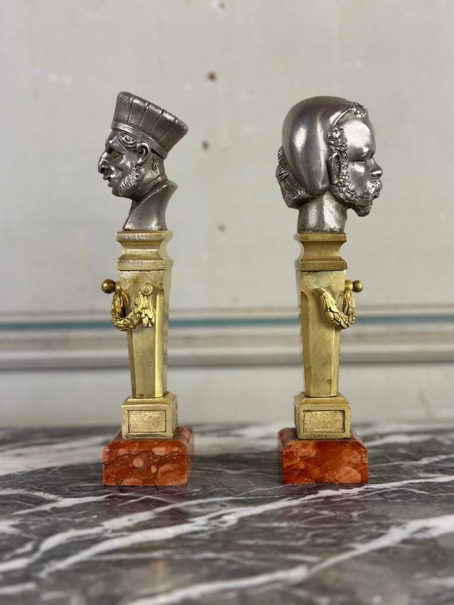 Pair of Abyssinian busts in nickel on gilded bronze and marble bases, 19th century.