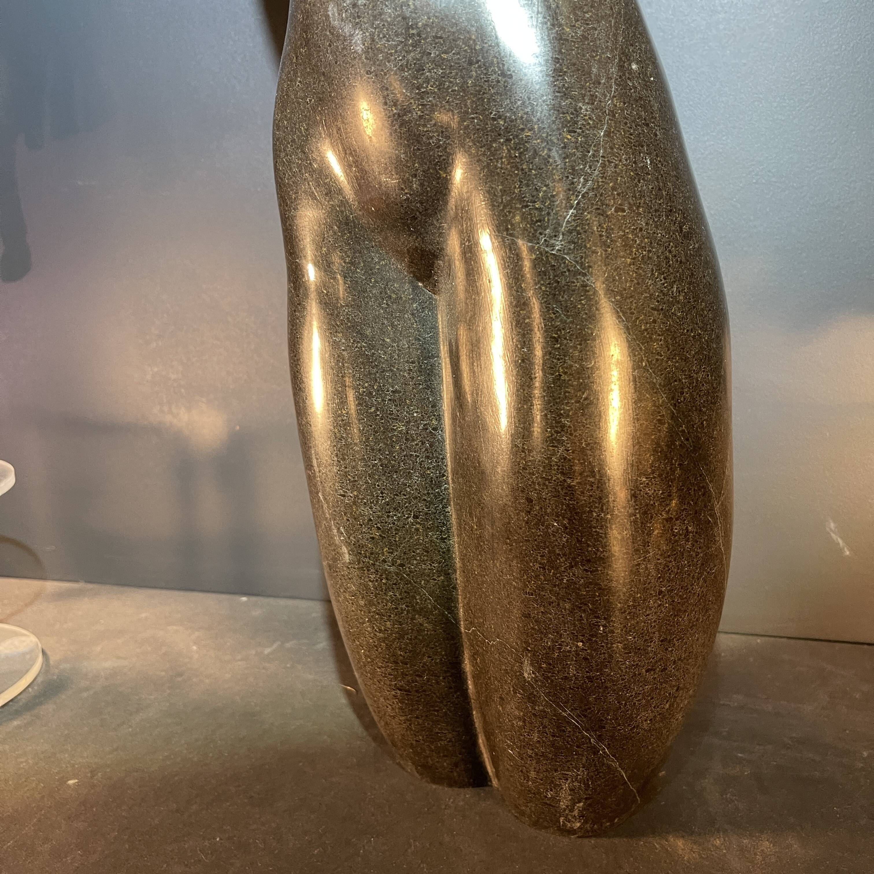 Abstract sculpture "naked woman" in stone (black marble), signed work, 20th century