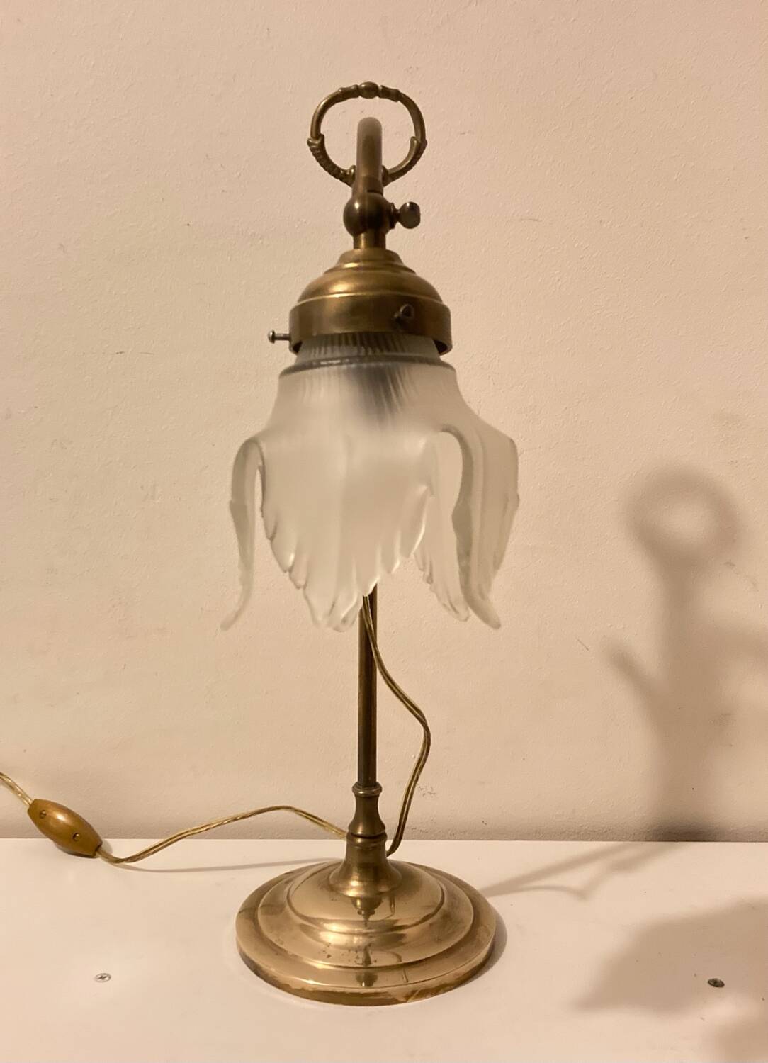Brass table lamp with a glass shade