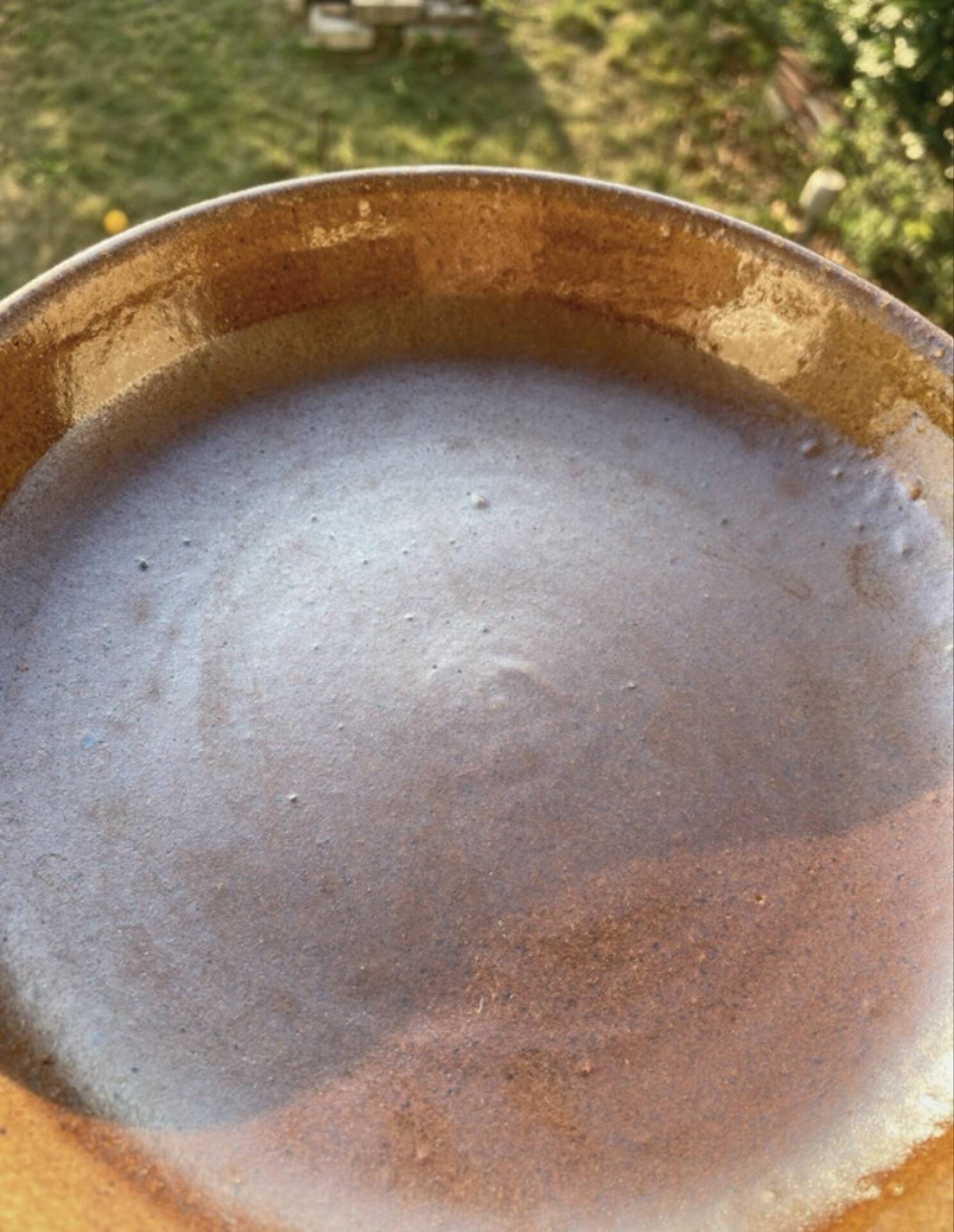 Deep plates made of organic, wild, earthy marsh clay.