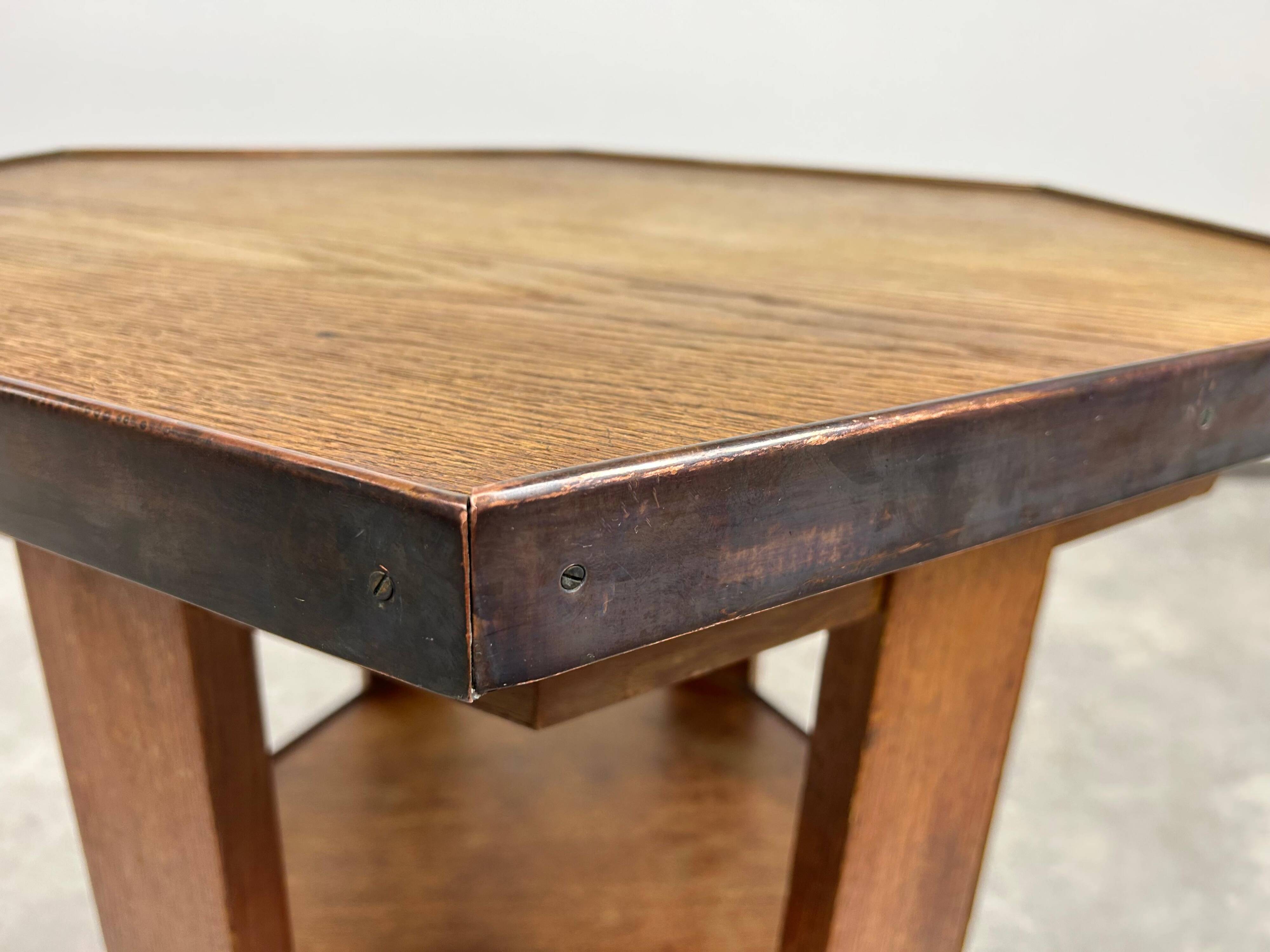Hexagonal table with six legs in Secession style bordered with brass, attributed to Adolf Loos.