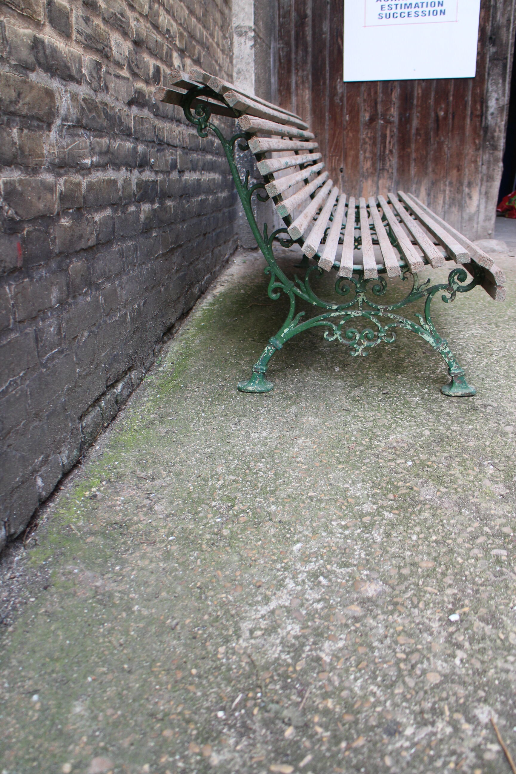 Old bench cast iron base and wooden slats