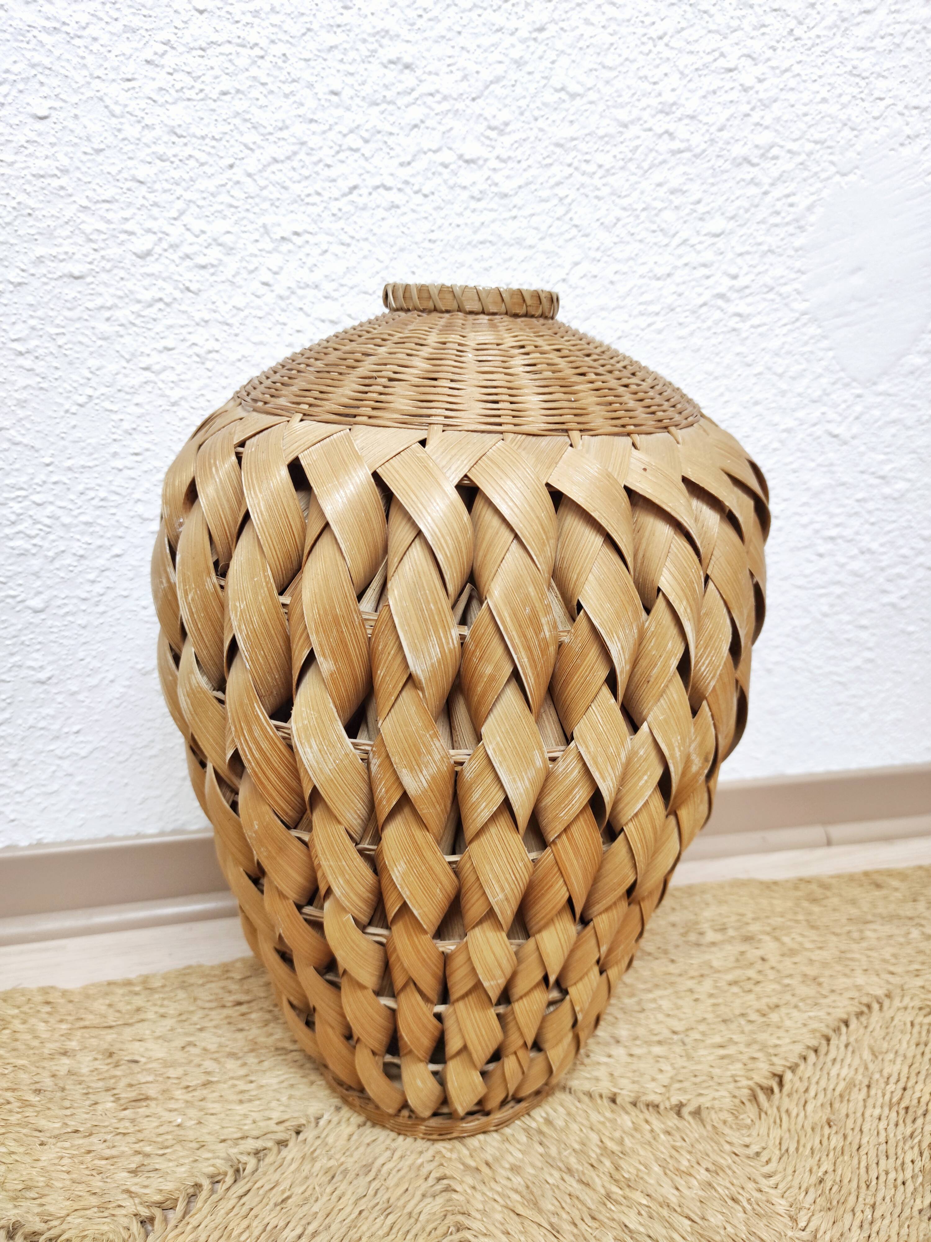 Vase in braided bamboo leaves