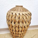 Vase in braided bamboo leaves