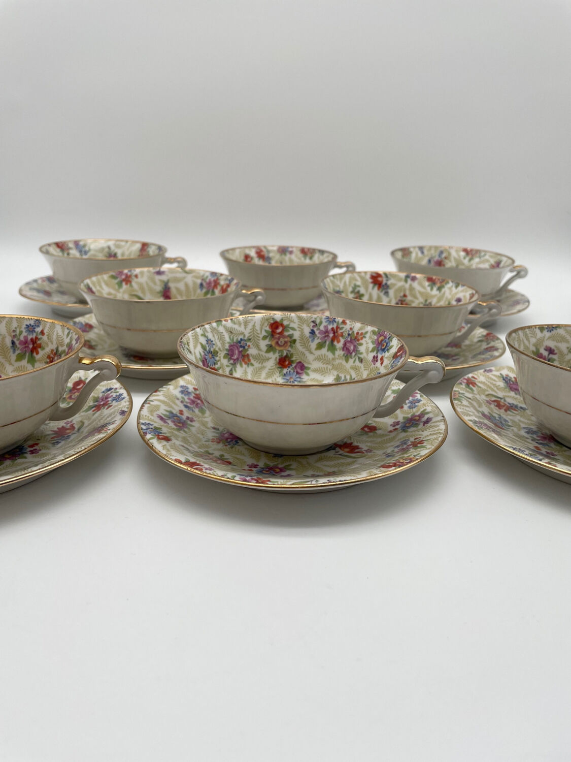 Set of 8 Limoges porcelain coffee cups from France with floral and gold pattern