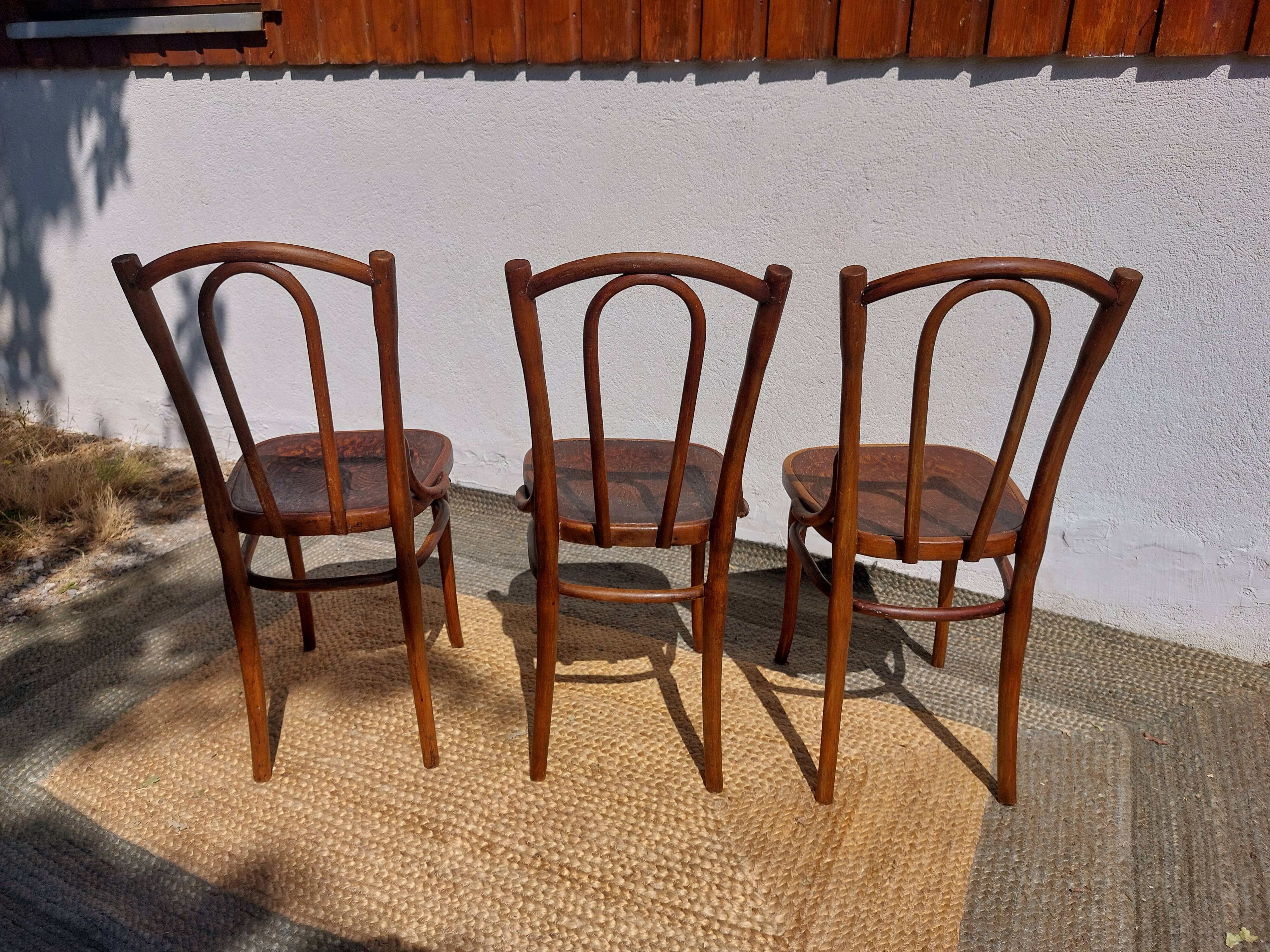 set of 3 curved wooden bistro chairs with patterns
