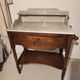 Dressing table in oak wood with a slightly veined white marble top.