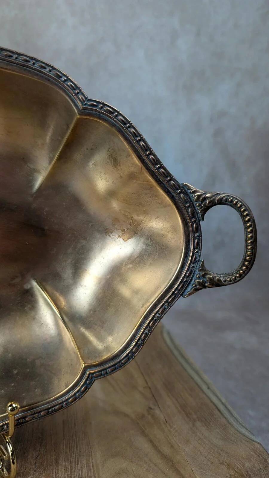 Antique oval silver-plated copper tray with handles.