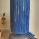 Table lamp in black stoneware and natural raffia.