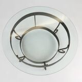 Rustic round coffee table with wrought iron base and glass top, France, 1930s