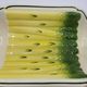 Salins earthenware slip dish decorated with asparagus, French, yellow and green, 20th century