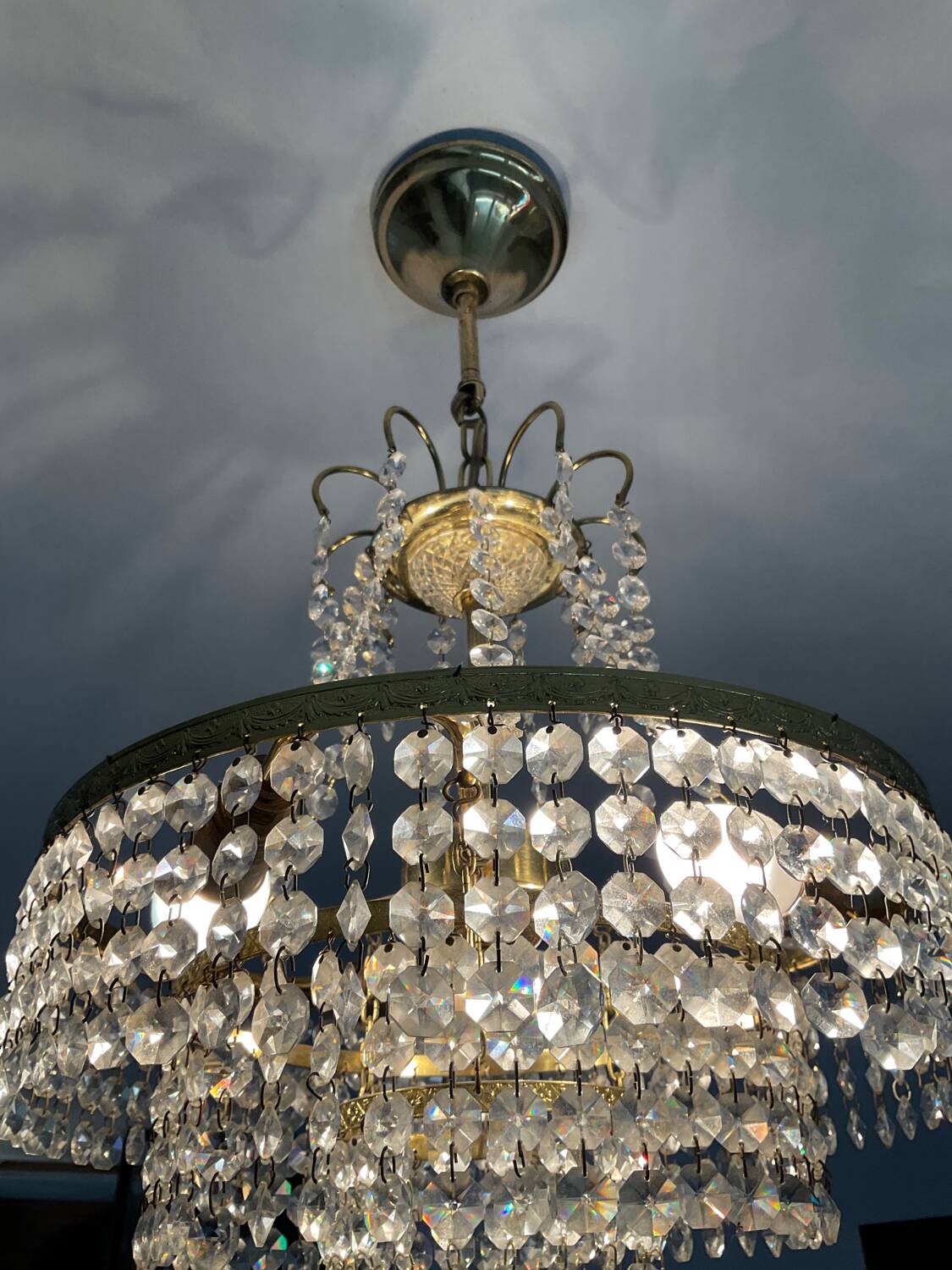 Cascade chandelier with crystal and brass tassels
