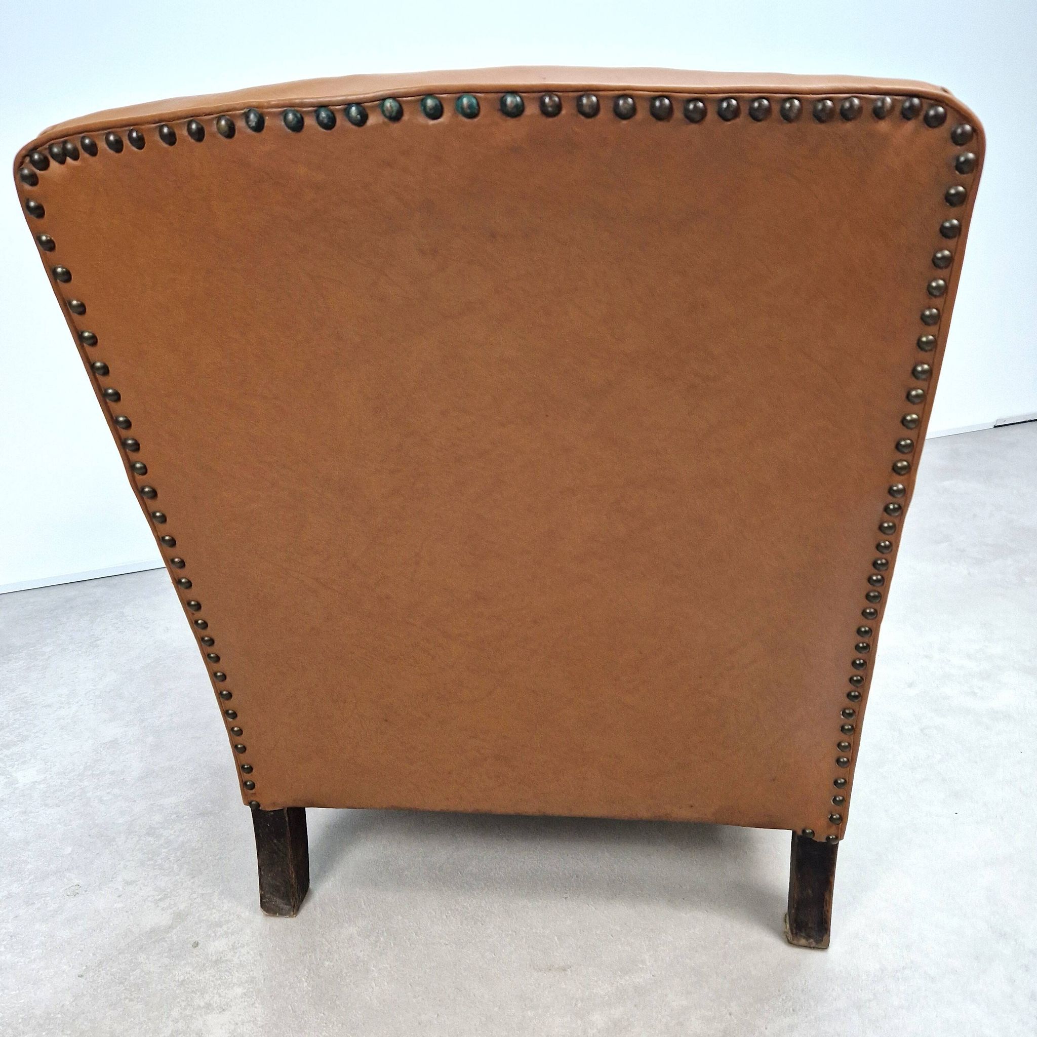 50s club chair in imitation leather and wood