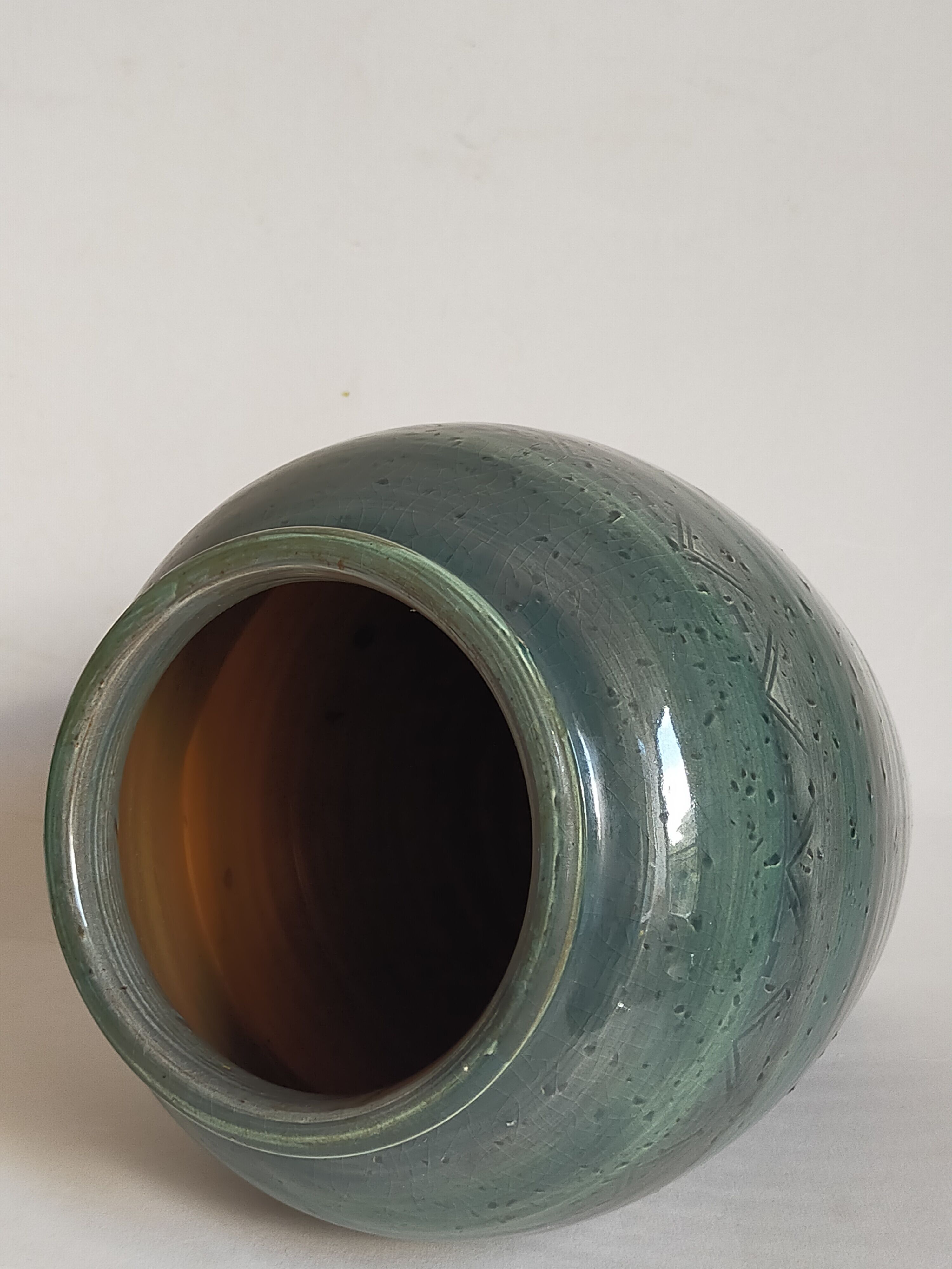 Oblong ceramic vase sacrificed with blue enamel