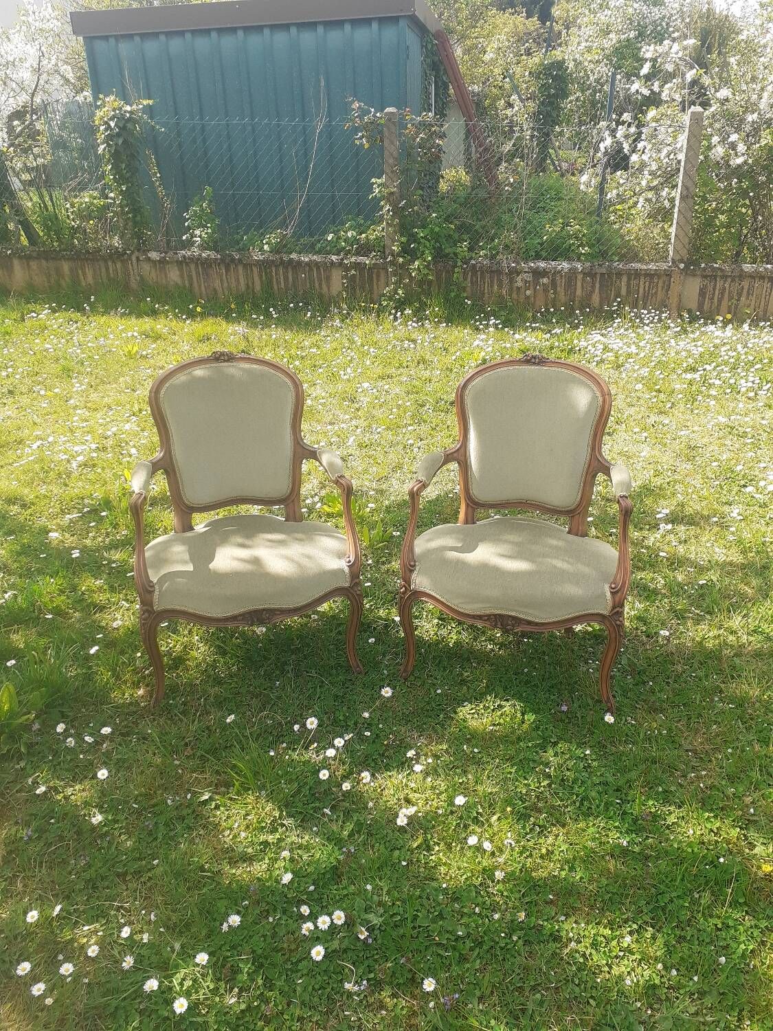 Pair of Rocaille style armchairs in green fabric and walnut, 19th century
