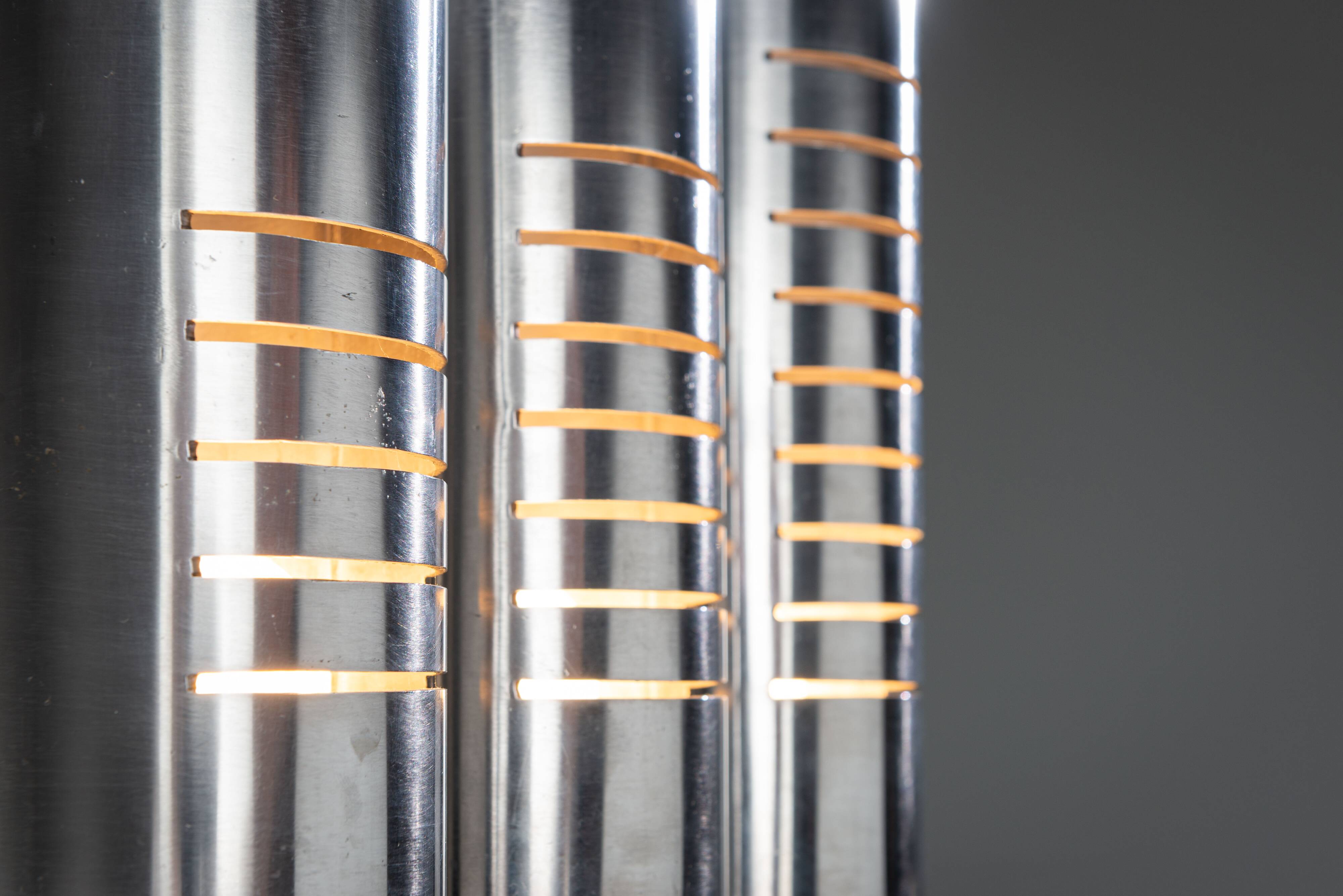 Triple column table lamp in stainless steel by Goffredo Reggiani