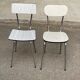 2 beige formica and steel chairs