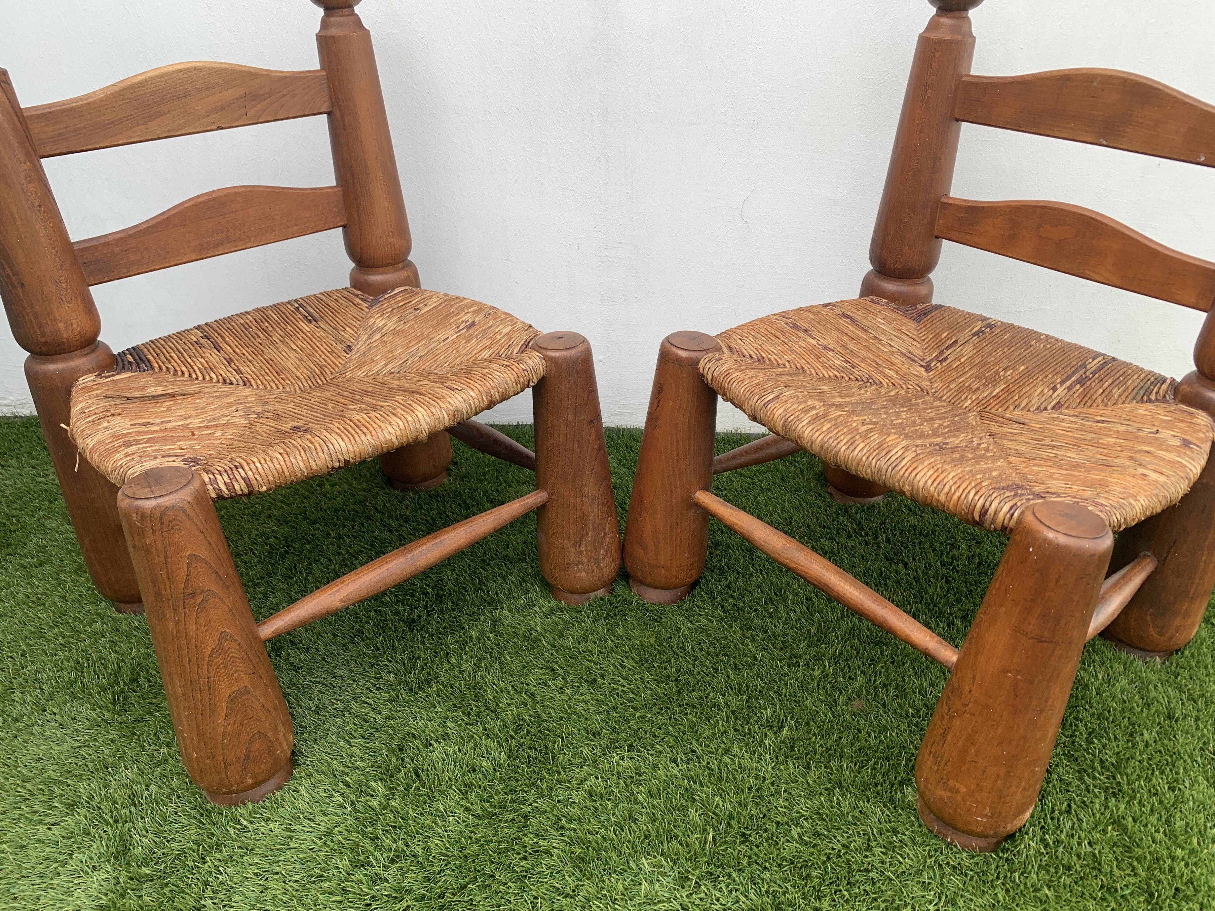 Pair of antique low fire chairs made of wood and straw