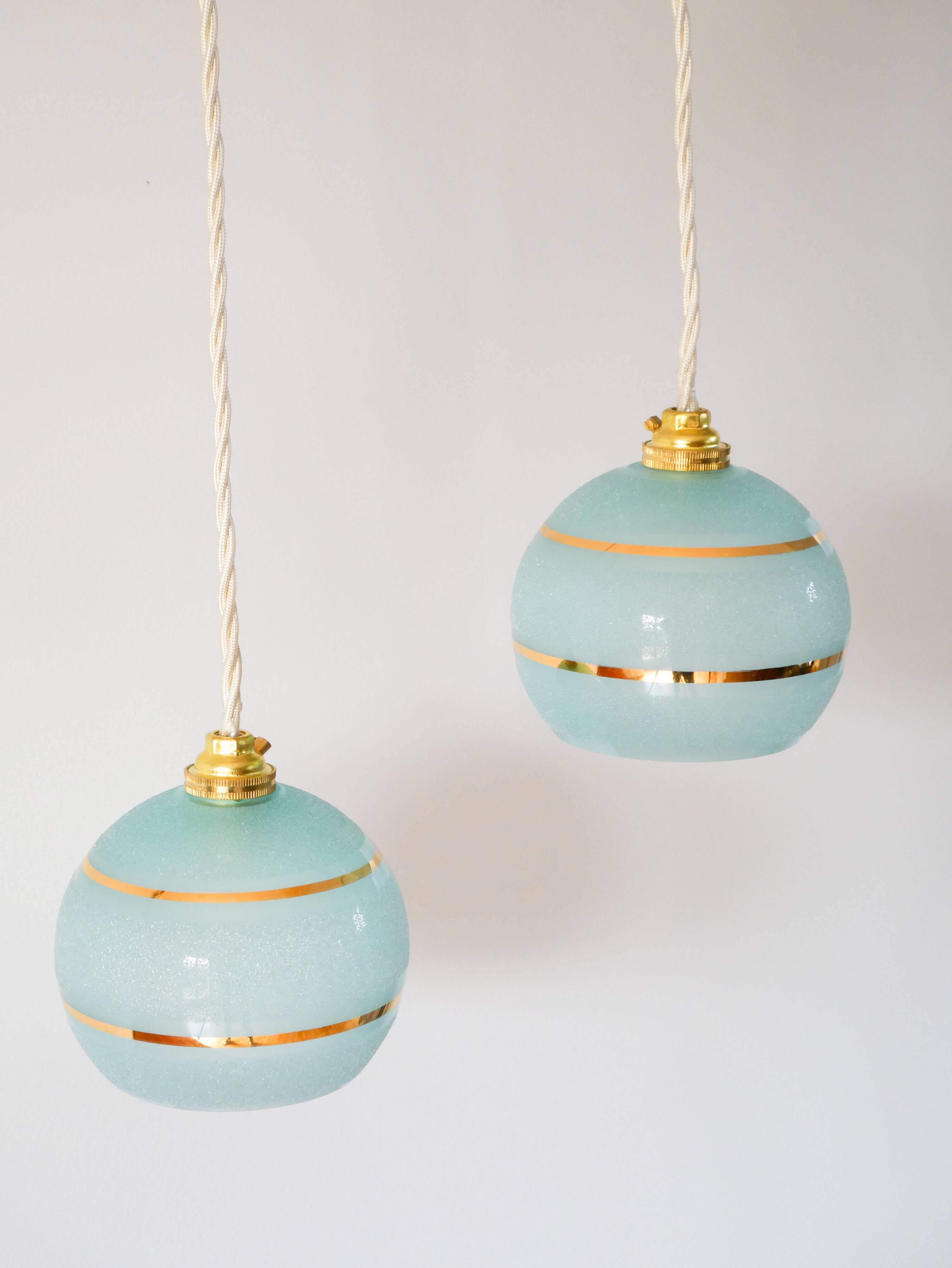 pair of blue and gold granite ball pendants 1950
