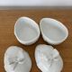 Pair of porcelain egg-shaped pocket trays