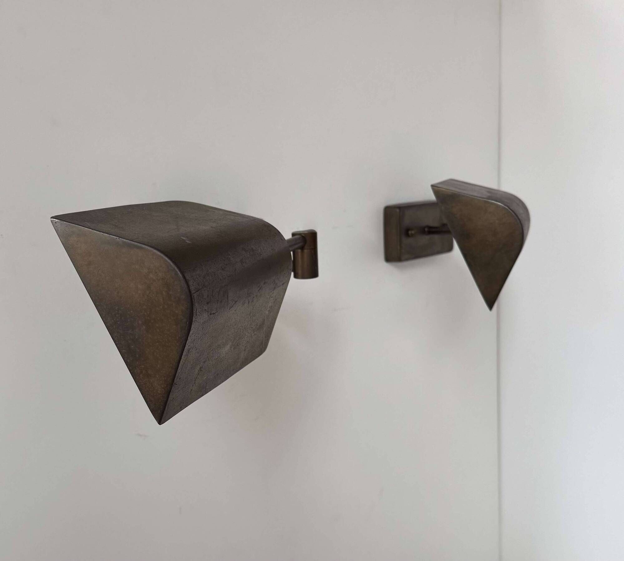Pair of vintage adjustable wall lights, patinated brass, France 1970.