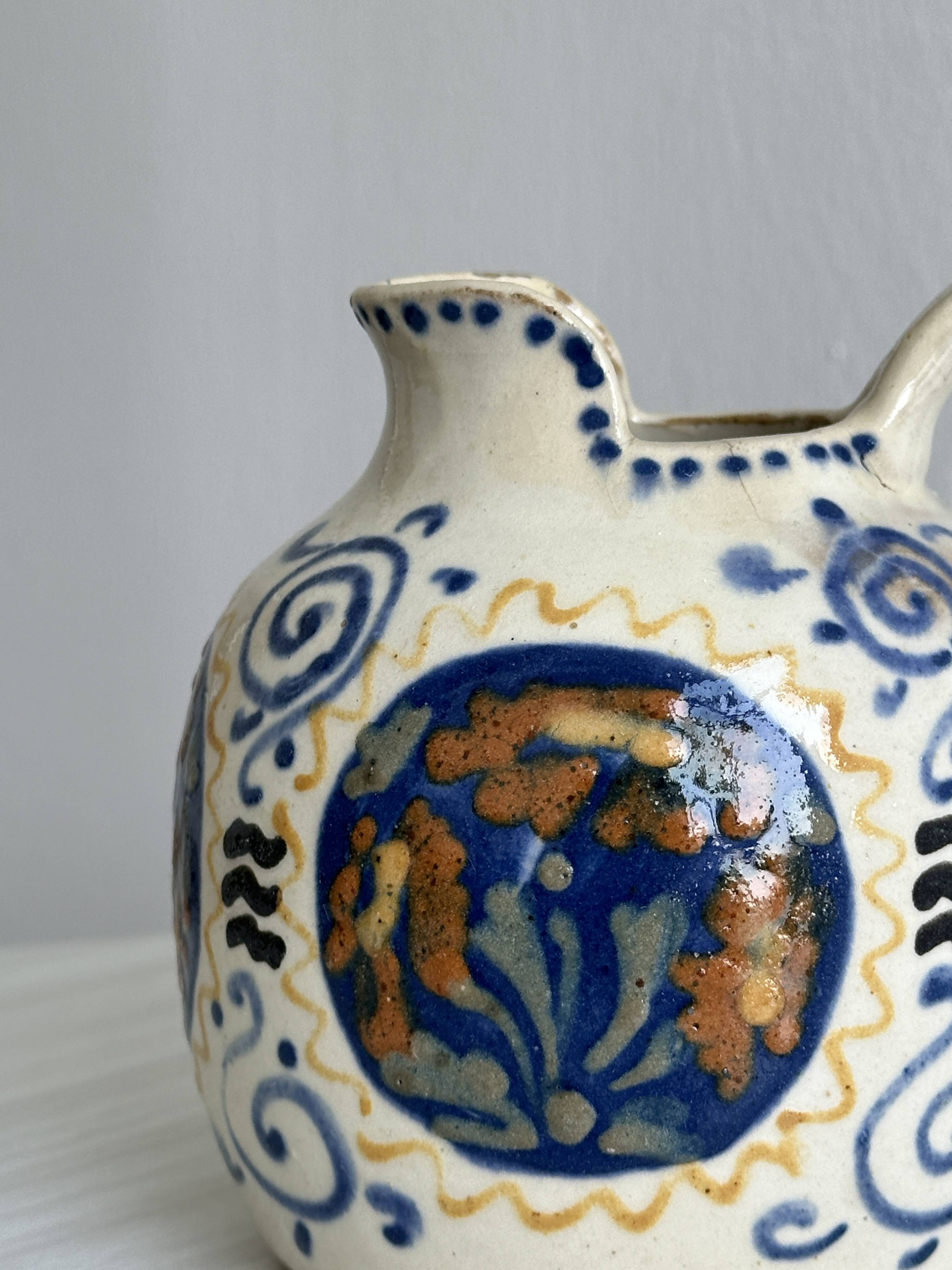 Hand painted ceramic decorative pitcher