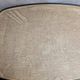 Large vintage 1960s platter with floral decoration on a black background and golden handles.
