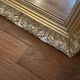Antique mirror with a wooden and gilded stucco frame.