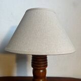 Table lamp with carved wooden base