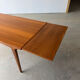 Rectangular extendable table with a Scandinavian design in solid teak.