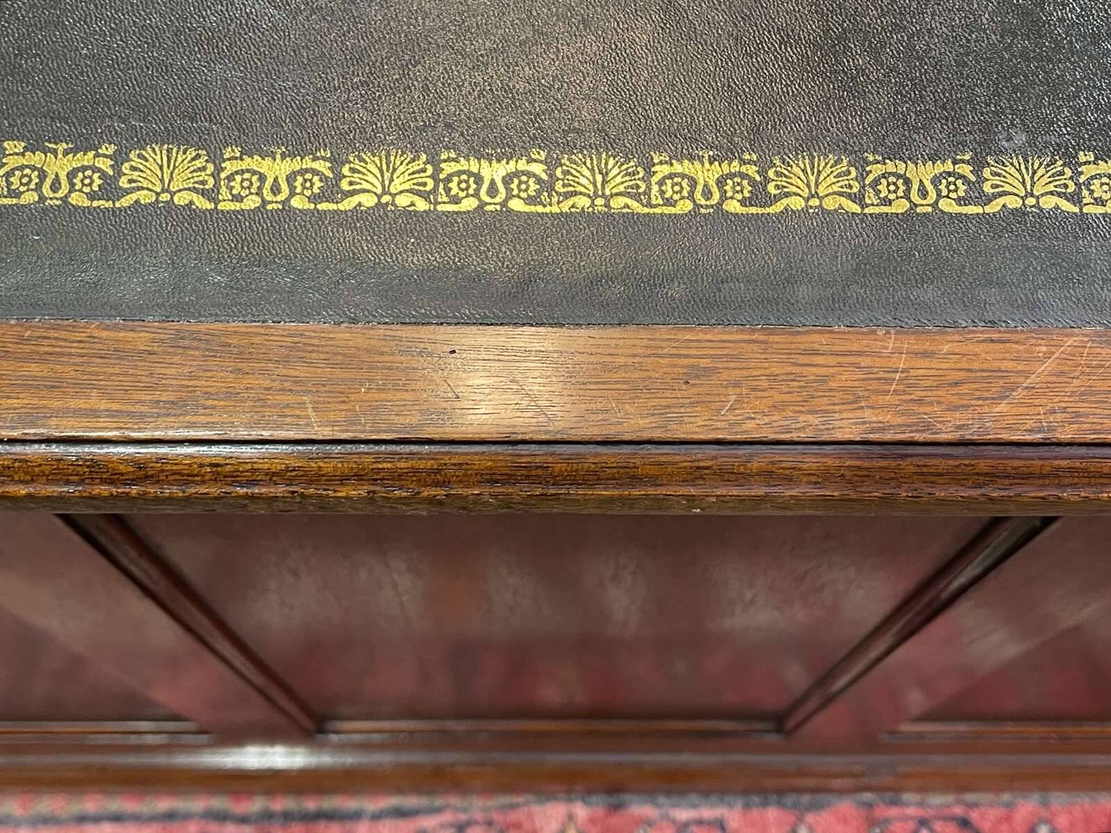 Large English flat desk in mahogany with leather top, early 20th century
