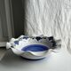Small hand-painted earthenware salad bowl with garland of blue flowers, mark below