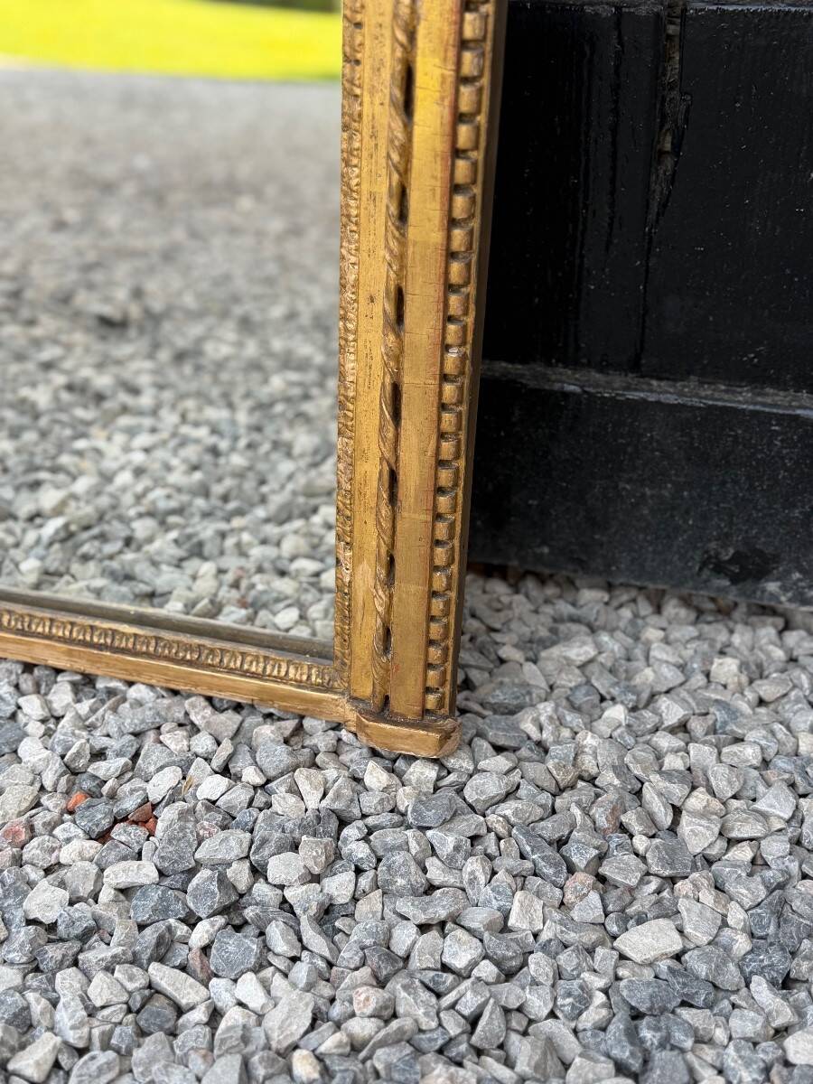 Louis XVI mirror in carved and gilded wood, 18th century